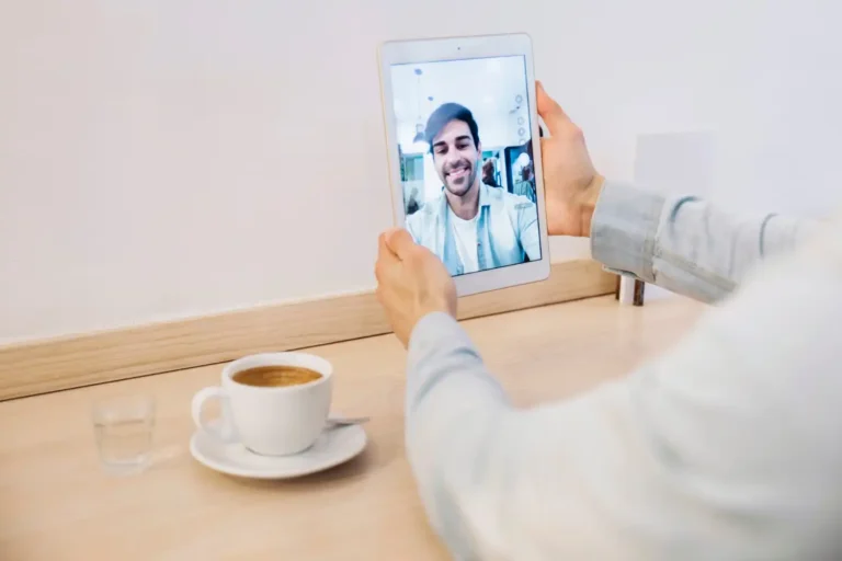 crop-man-holding-tablet-with-selfie